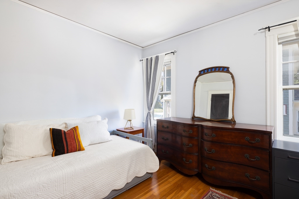 71 Congreve Street, Unit 2 Boston, MA 02131 - Photo 8 of 12 a bedroom with a bed and a dresser