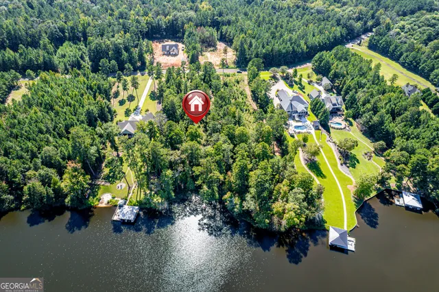 an aerial view of a house with a yard and garden space