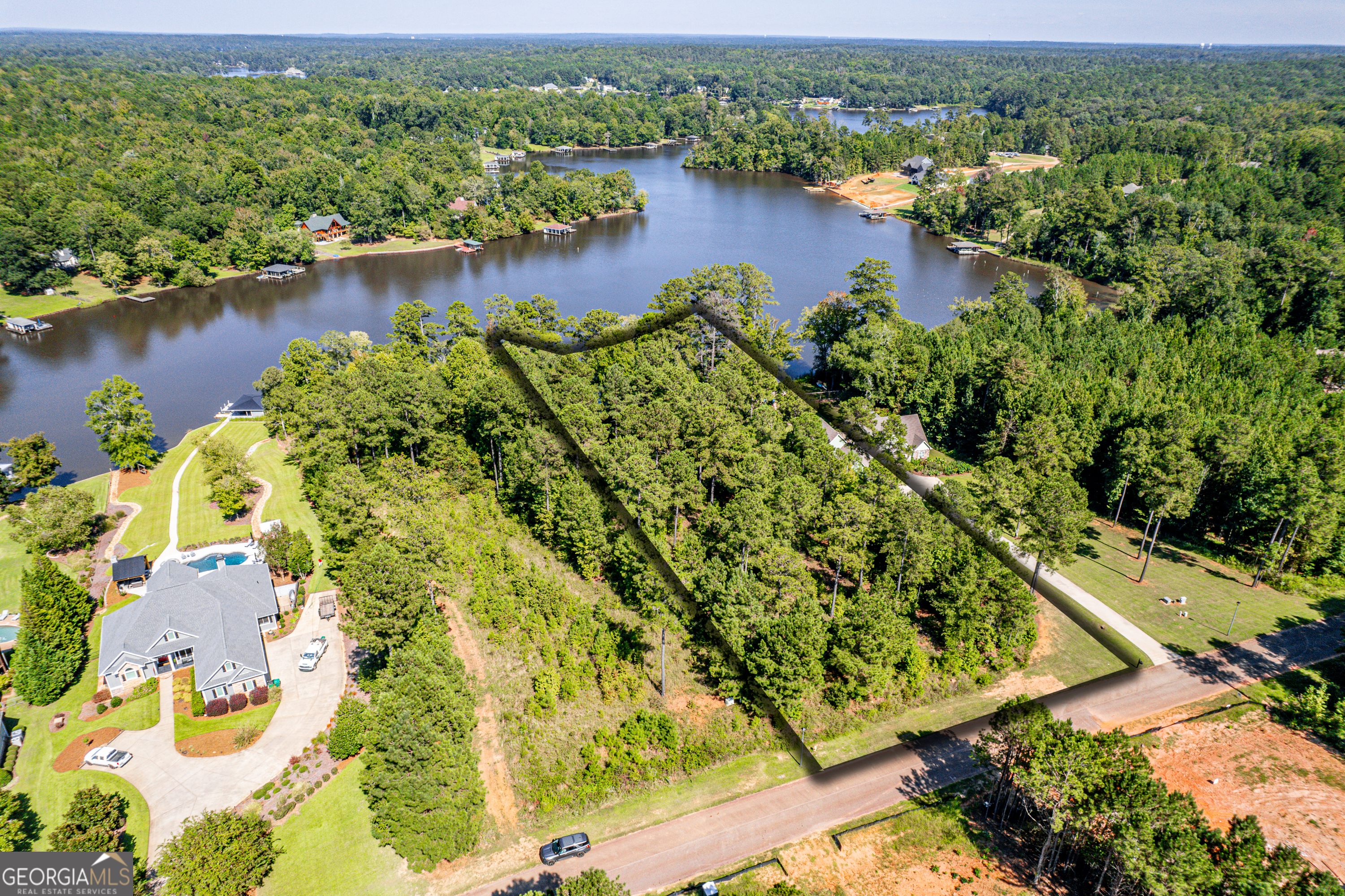 642 Parham Road Northwest Milledgeville, GA 31061 - Photo 12 of 12 an aerial view of lake residential house with outdoor space and trees