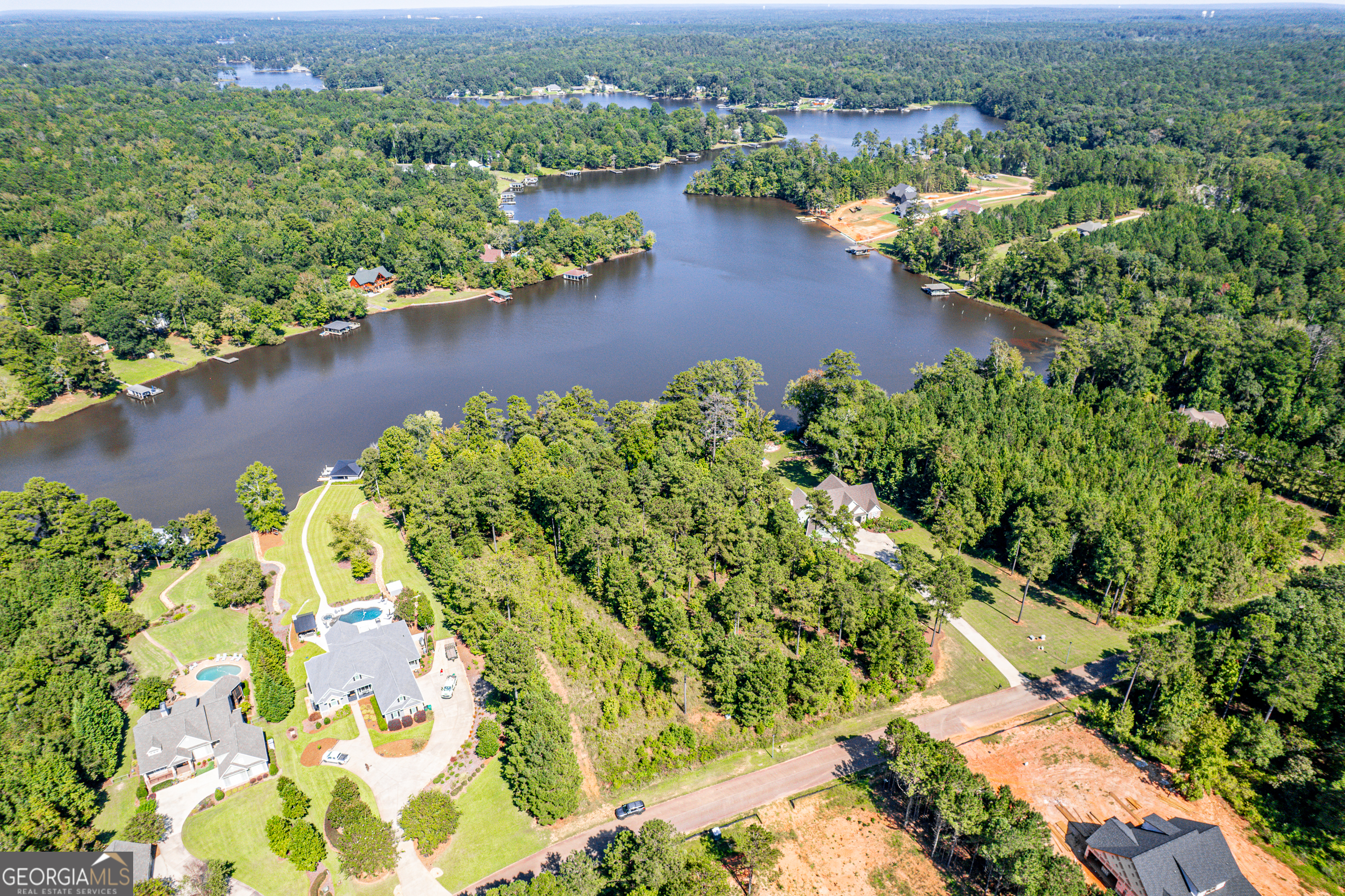 642 Parham Road Northwest Milledgeville, GA 31061 - Photo 3 of 12 an aerial view of lake residential house with outdoor space and trees around