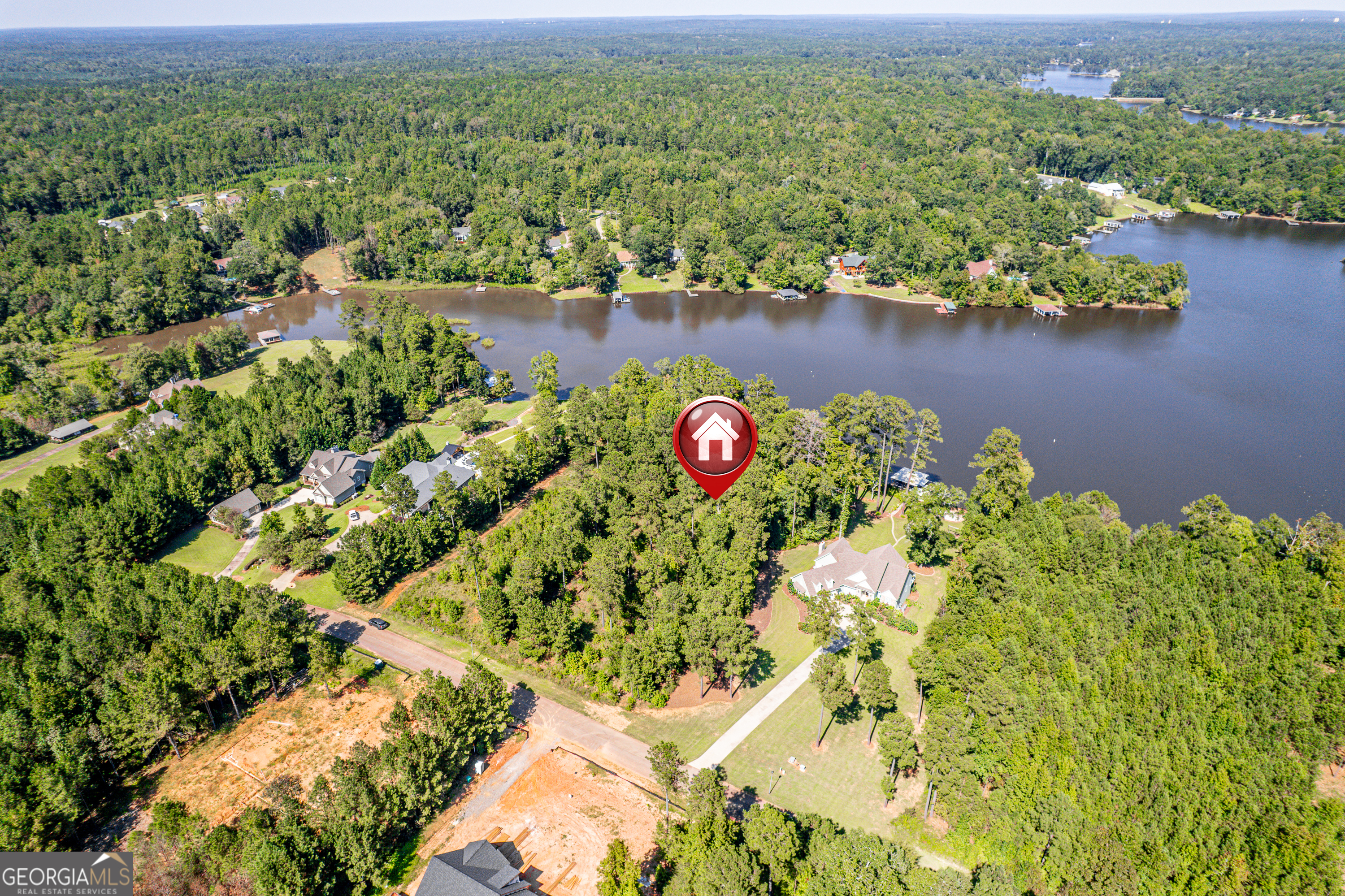 642 Parham Road Northwest Milledgeville, GA 31061 - Photo 6 of 12 an aerial view of residential house with outdoor space and lake view