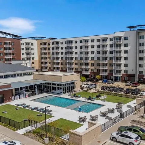 a view of a swimming pool with outdoor seating and yard