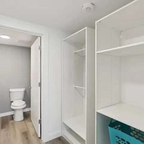 a bathroom with a toilet and a sink