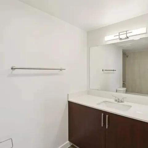 a bathroom with a sink and mirror