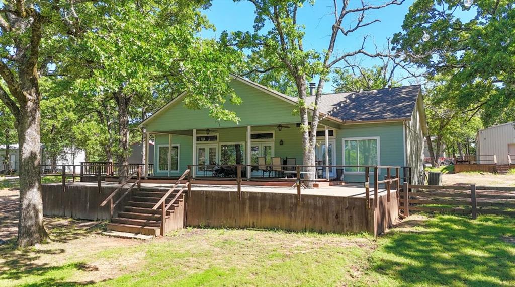 9501 Oakwood Road Quinlan, TX 75474 - Photo 3 of 34 a view of a house with swimming pool and sitting area