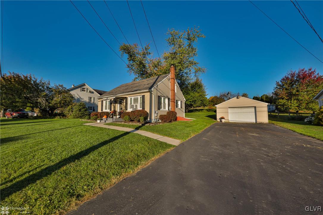 622 Hahn Road Nazareth, PA 18064 - Photo 5 of 37 a front view of a house with a yard and garage