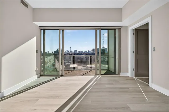 a bedroom with a large bed and a large window