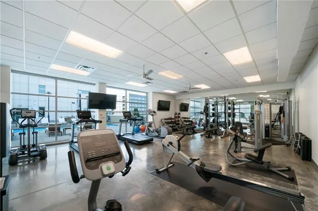 a view of a livingroom with furniture and a flat screen tv