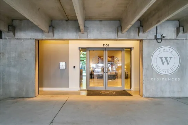 a view of a hallway with bathroom