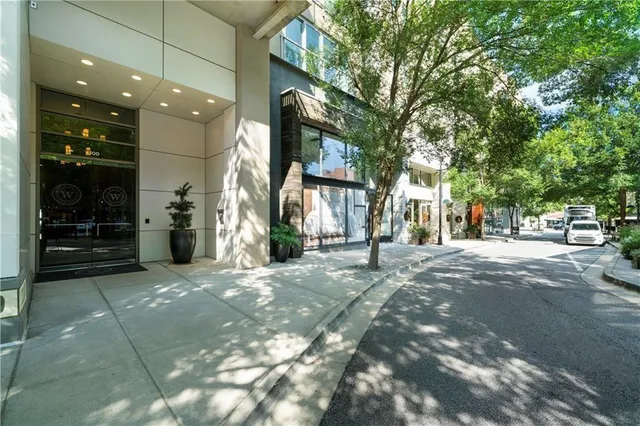 a view of a building with a lot of flower plants