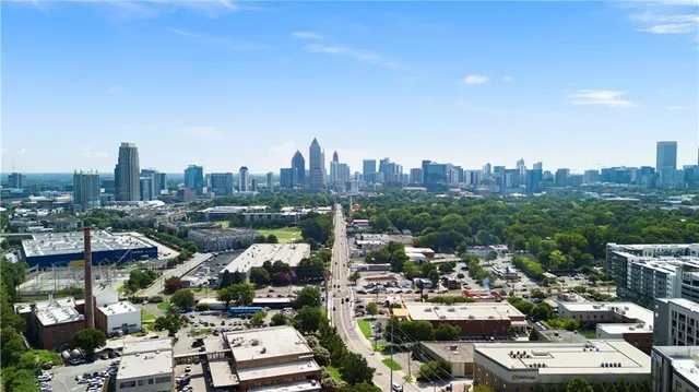 a view of a building with potted plants in front of it