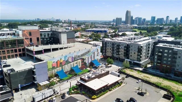 a view of a building with a sitting area