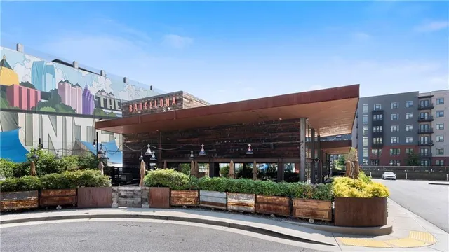 a view of a building with a potted plant front of house