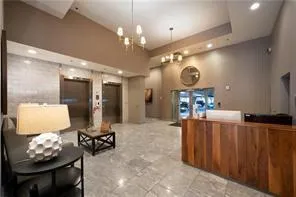 a large room with mirror and furniture