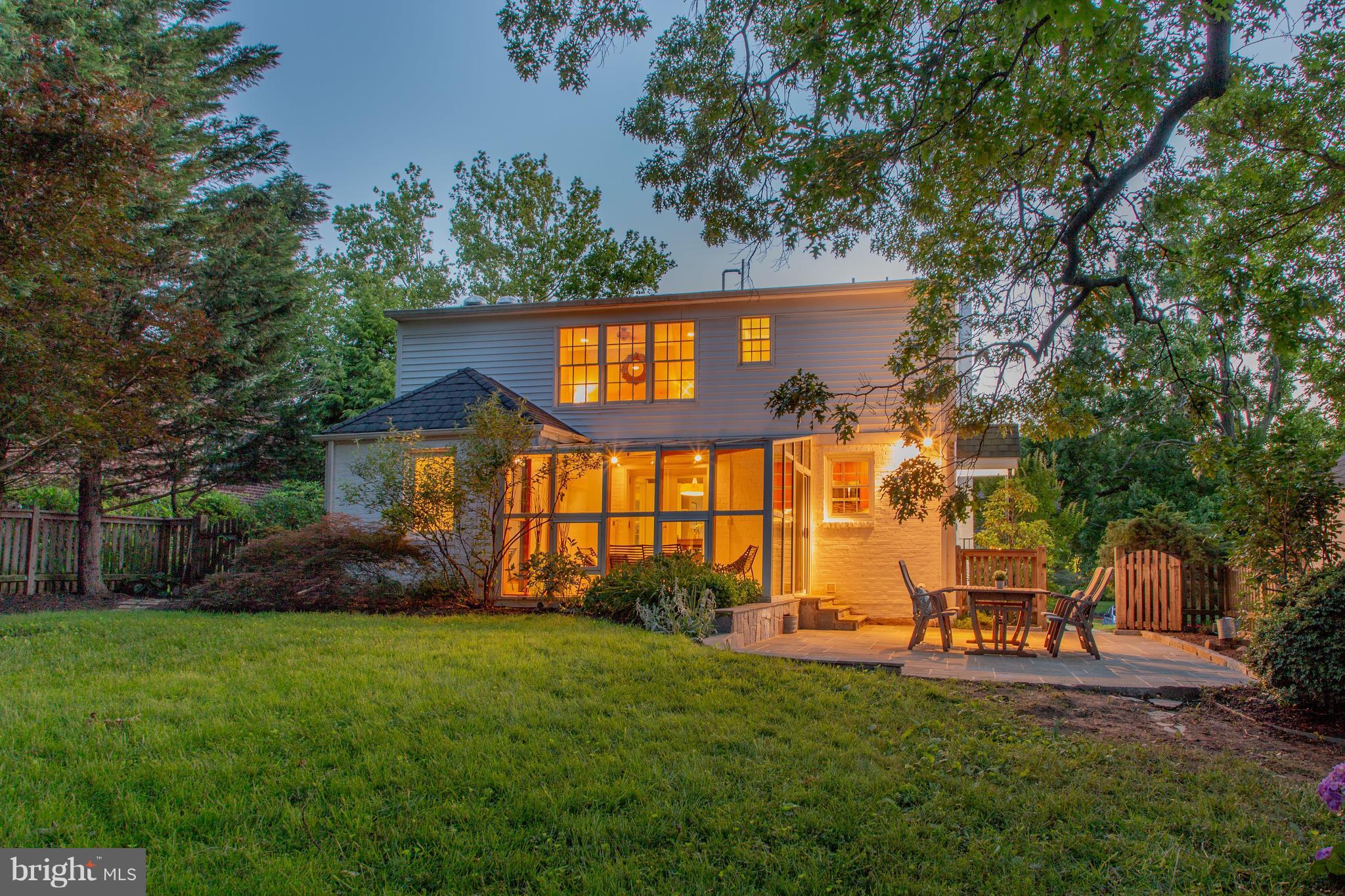 9105 Flower Avenue Silver Spring, MD 20901 - Photo 2 of 30 a front view of a house with a yard and trees