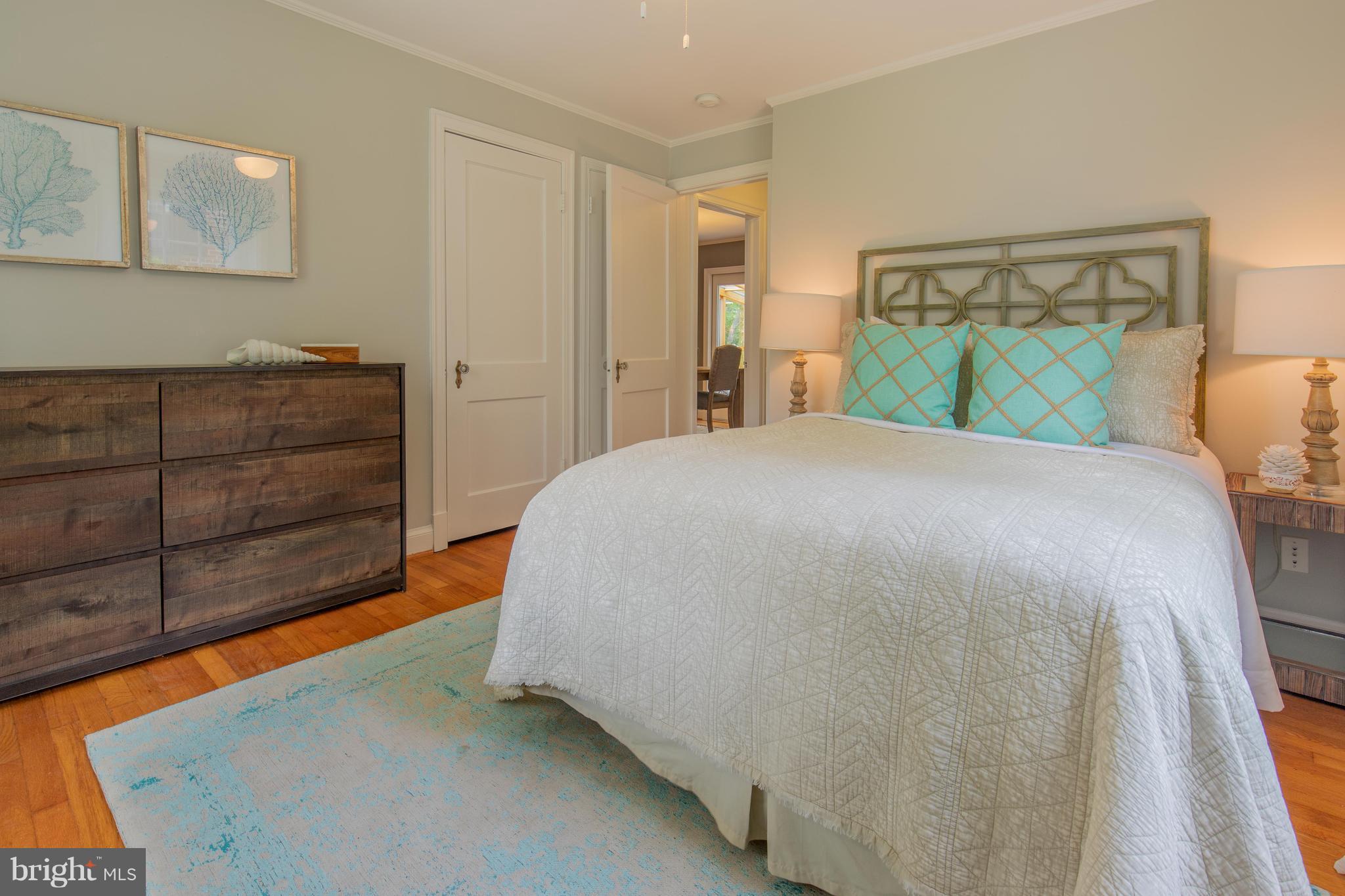 9105 Flower Avenue Silver Spring, MD 20901 - Photo 14 of 30 a bedroom with a bed and cabinet