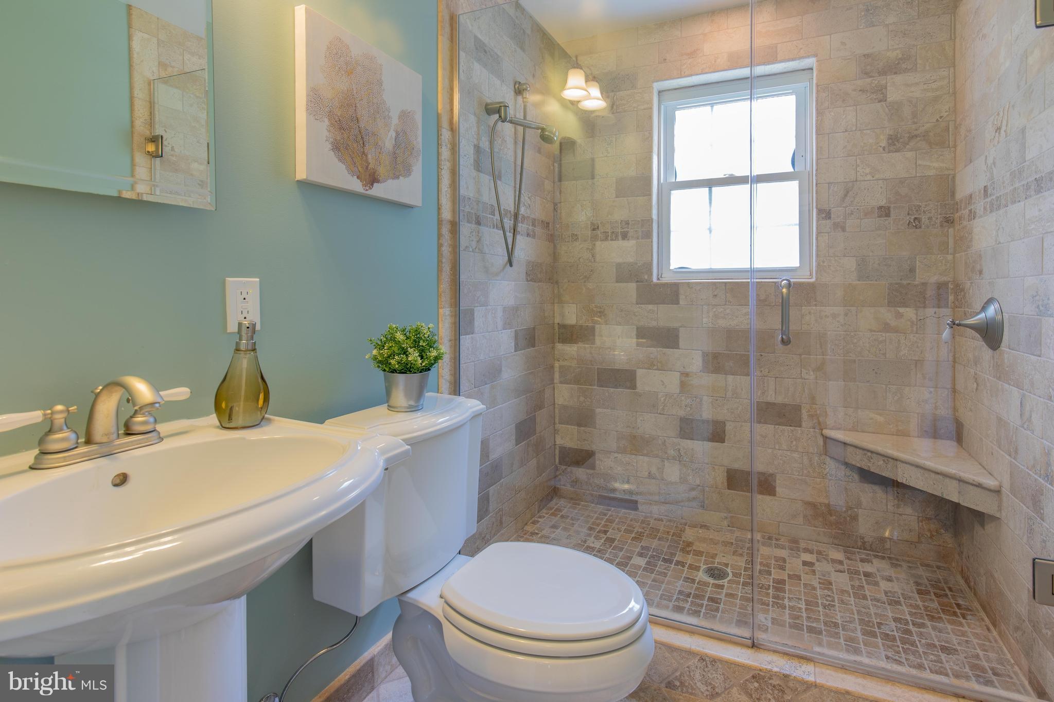 9105 Flower Avenue Silver Spring, MD 20901 - Photo 15 of 30 a bathroom with a sink a toilet and shower