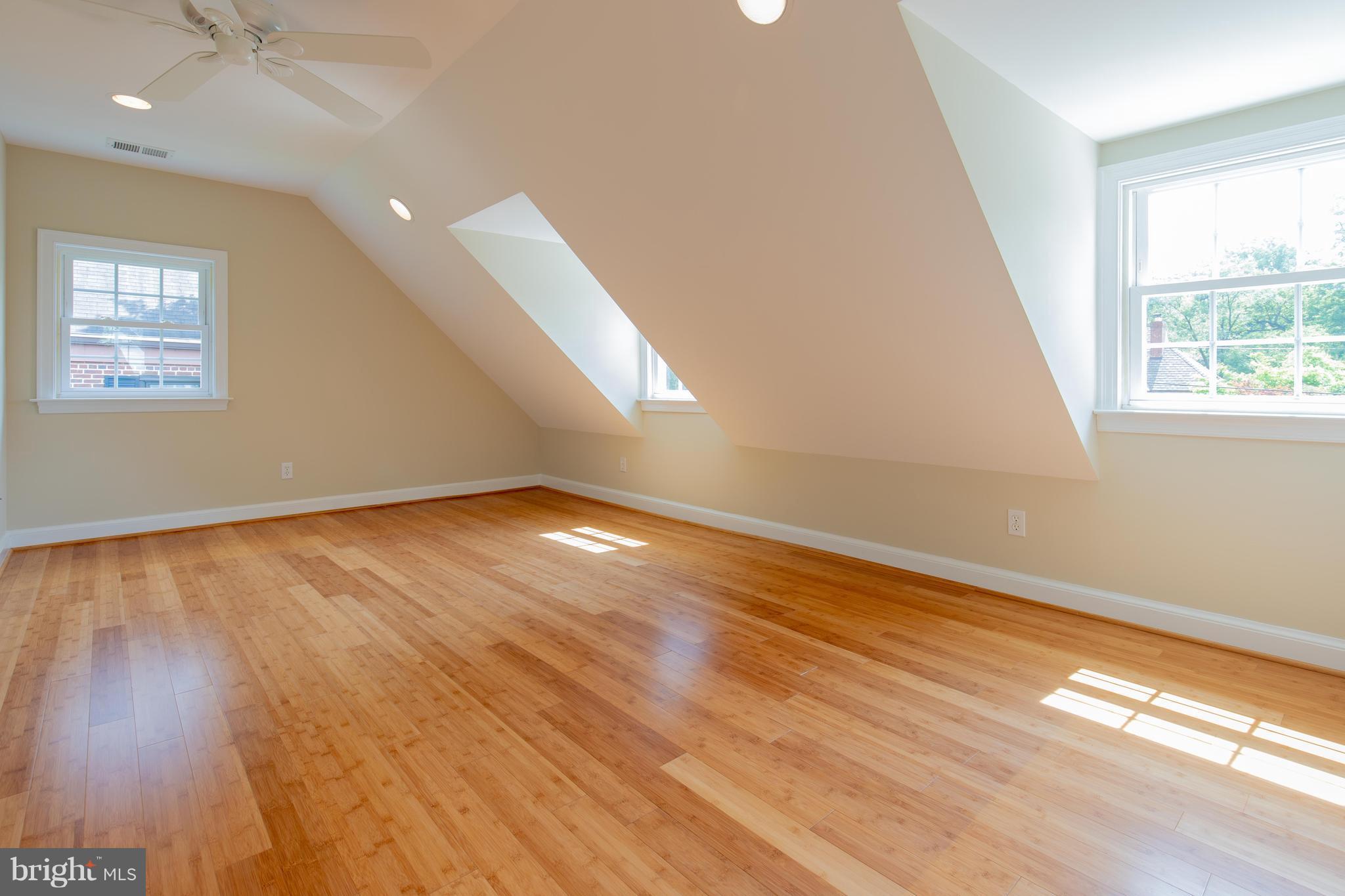9105 Flower Avenue Silver Spring, MD 20901 - Photo 19 of 30 an empty room with wooden floor and windows