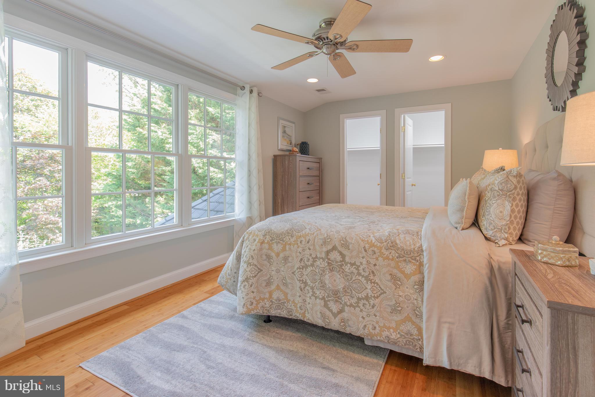 9105 Flower Avenue Silver Spring, MD 20901 - Photo 21 of 30 a spacious bedroom with a large bed and a window