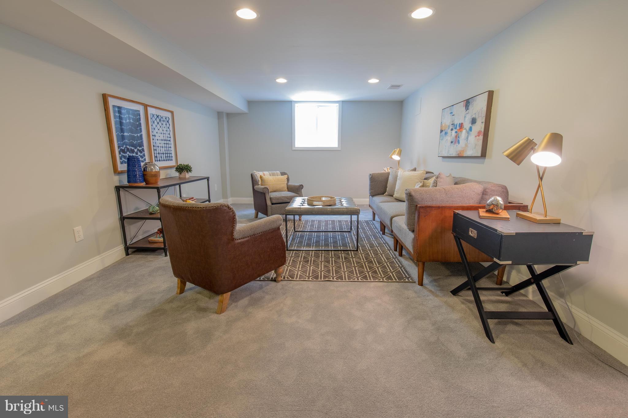 9105 Flower Avenue Silver Spring, MD 20901 - Photo 26 of 30 a living room with furniture and a lamp