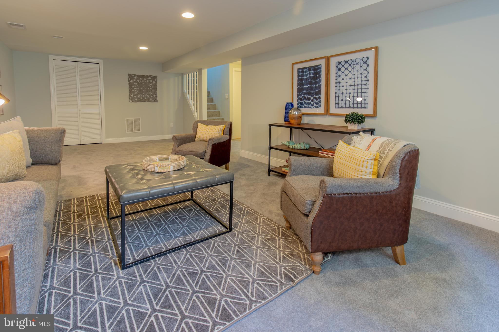 9105 Flower Avenue Silver Spring, MD 20901 - Photo 27 of 30 a living room with furniture and a wooden floor