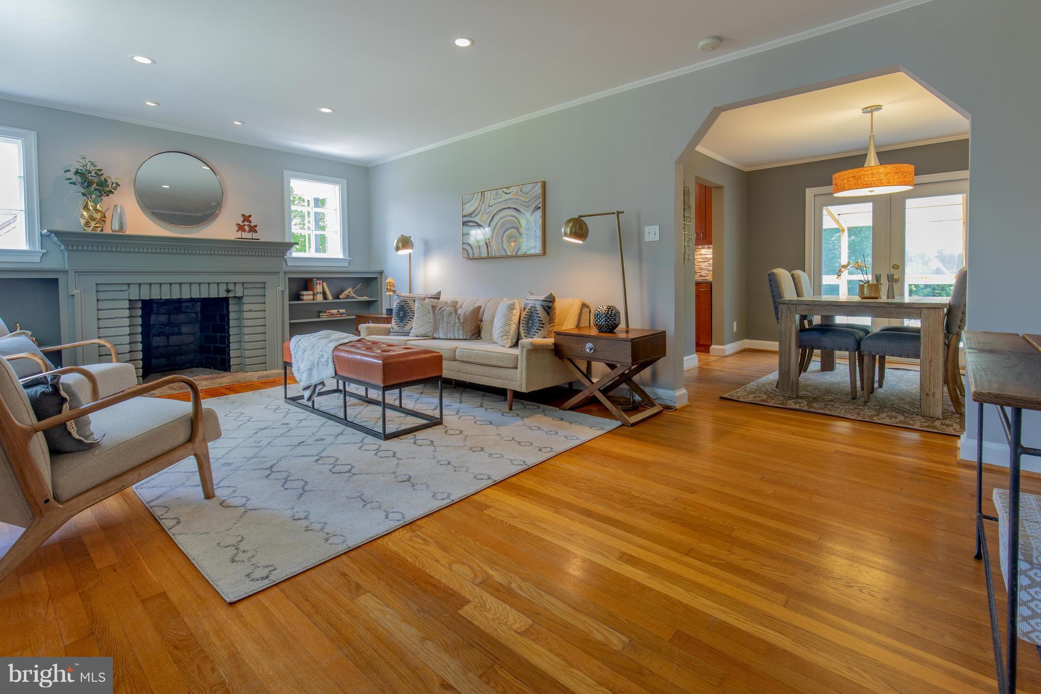 9105 Flower Avenue Silver Spring, MD 20901 - Photo 5 of 30 a living room with furniture and a fireplace