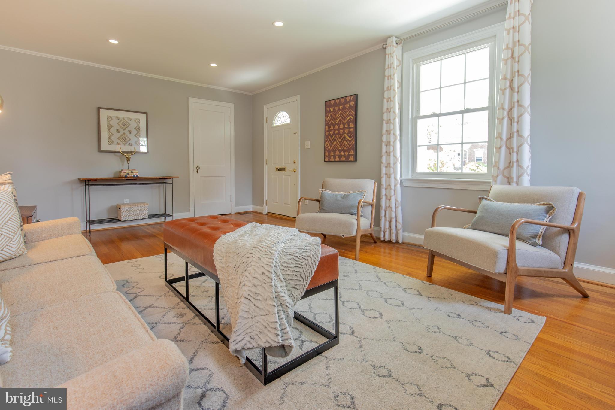 9105 Flower Avenue Silver Spring, MD 20901 - Photo 7 of 30 a living room with furniture and a window