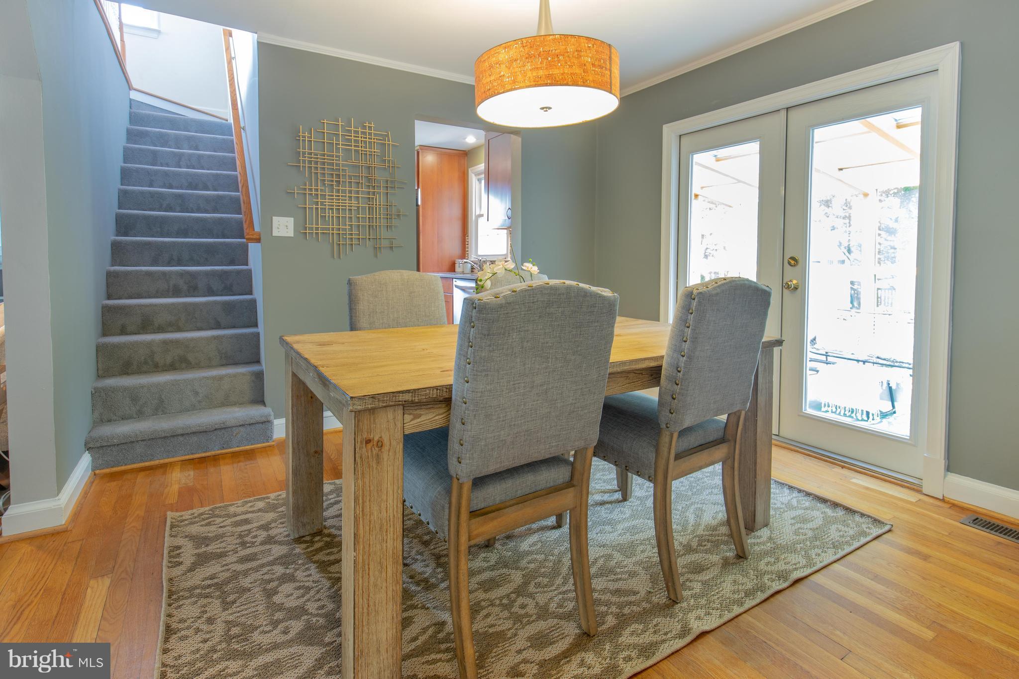 9105 Flower Avenue Silver Spring, MD 20901 - Photo 8 of 30 a view of a dining room with furniture window and wooden floor