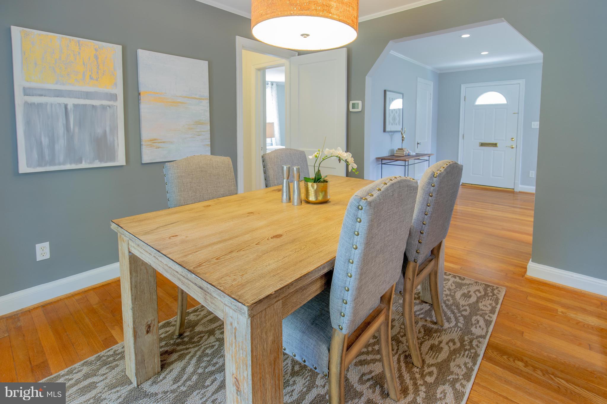 9105 Flower Avenue Silver Spring, MD 20901 - Photo 10 of 30 a view of a dining room with furniture and wooden floor