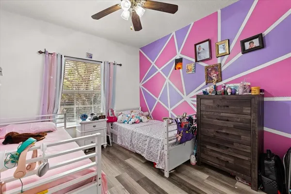 a bedroom with bed and a window