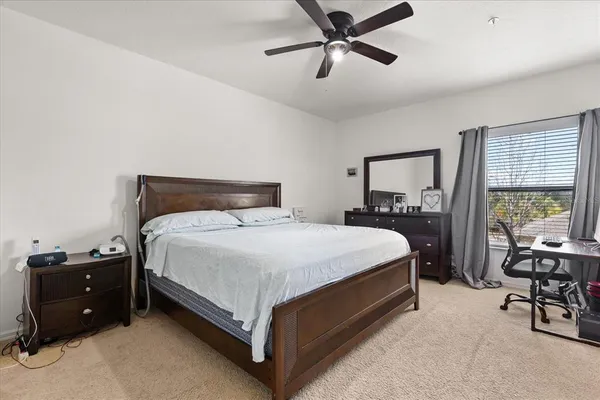 a bedroom with a bed and a table in it