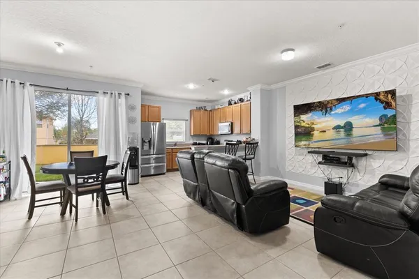 a living room with furniture and a flat screen tv