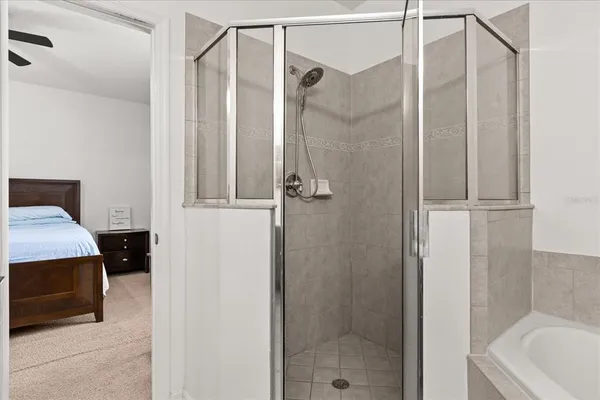 a bathroom with a tub and a shower