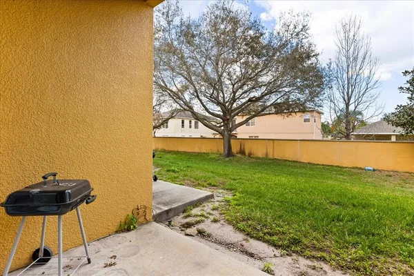 a view of a backyard with a garden and plants