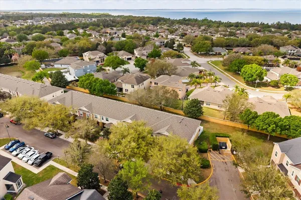 an aerial view of residential houses with outdoor space
