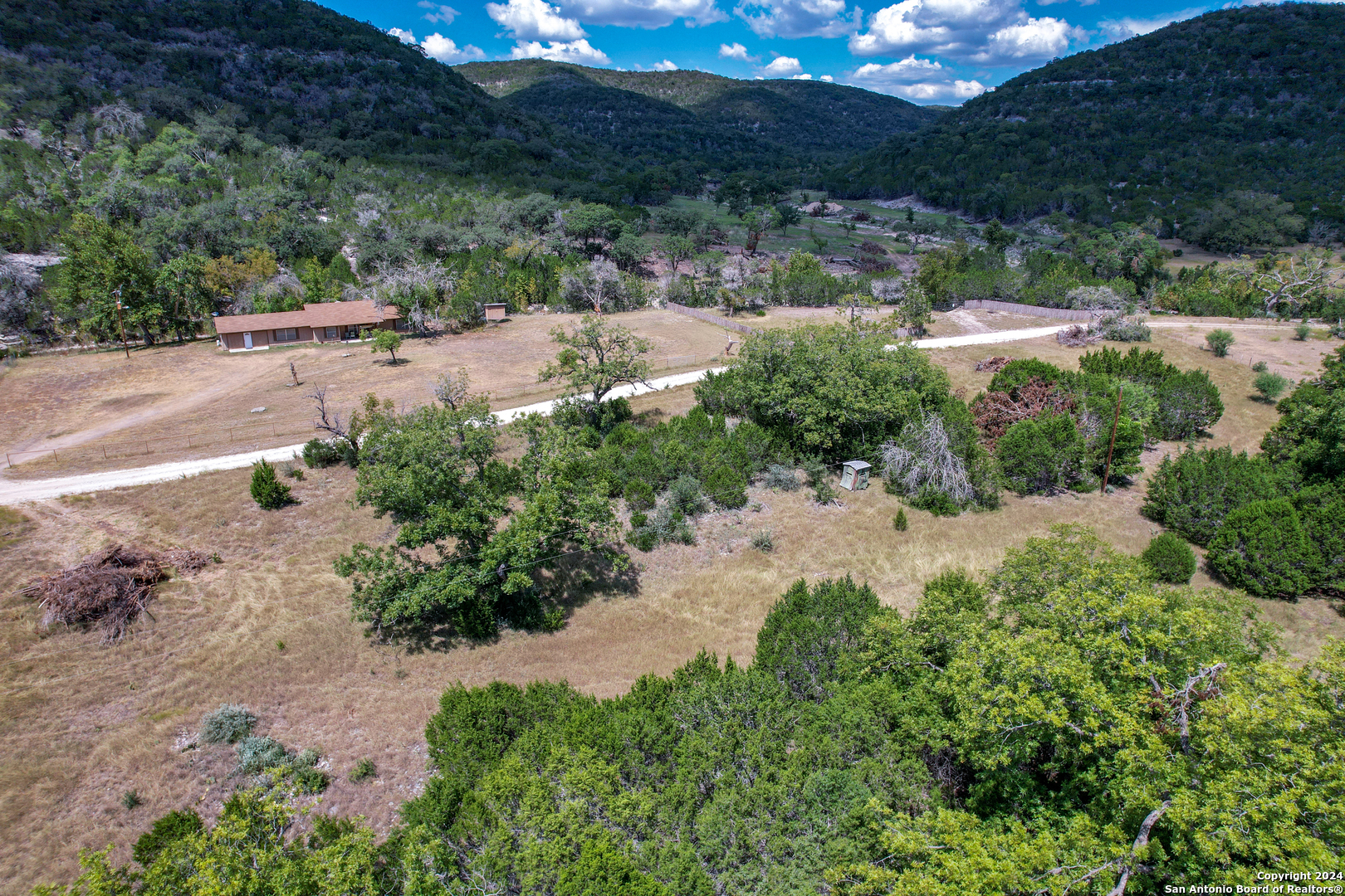 2227 Mill Creek Road Leakey, TX 78873 - Photo 17 of 20 a view of a street with a yard