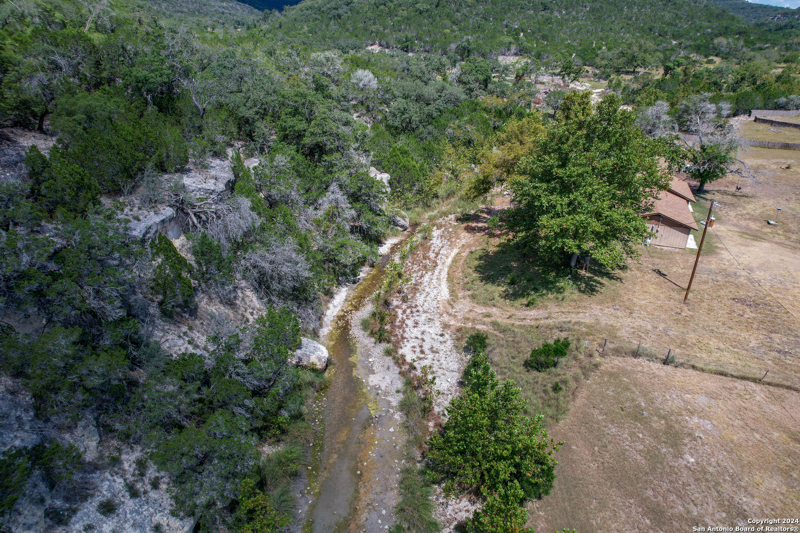 2227 Mill Creek Road Leakey, TX 78873 - Photo 19 of 20 an aerial view of residential house with outdoor space and trees all around