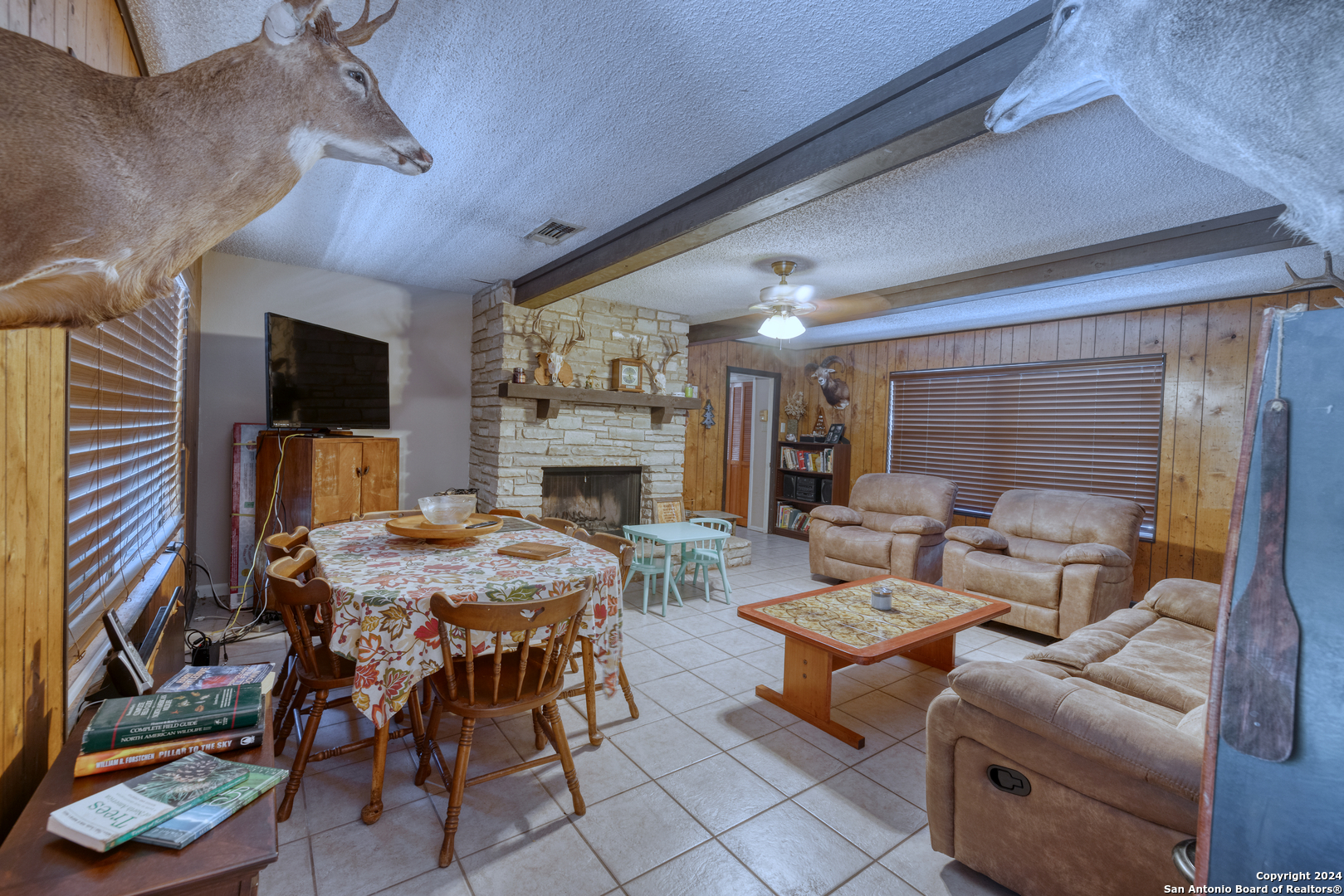 2227 Mill Creek Road Leakey, TX 78873 - Photo 8 of 20 a living room with furniture and a fireplace