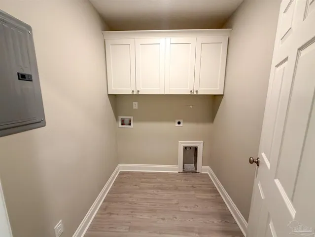a view of a kitchen with wooden floor and cabinet