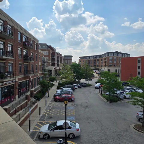 a picture of a building with sitting area