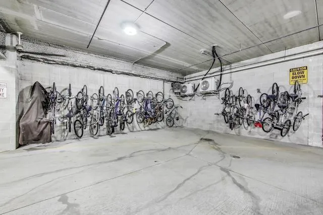 a view of parking garage with cars