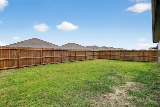 a view of a backyard with a garden