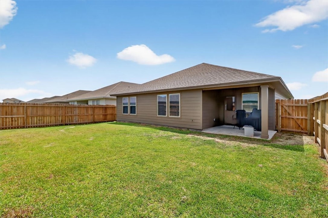 1126 Carnaby Street Corpus Christi, TX 78415 - Photo 15 of 39 a view of a house with backyard and porch