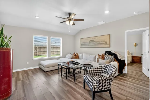 a bedroom with furniture and a window
