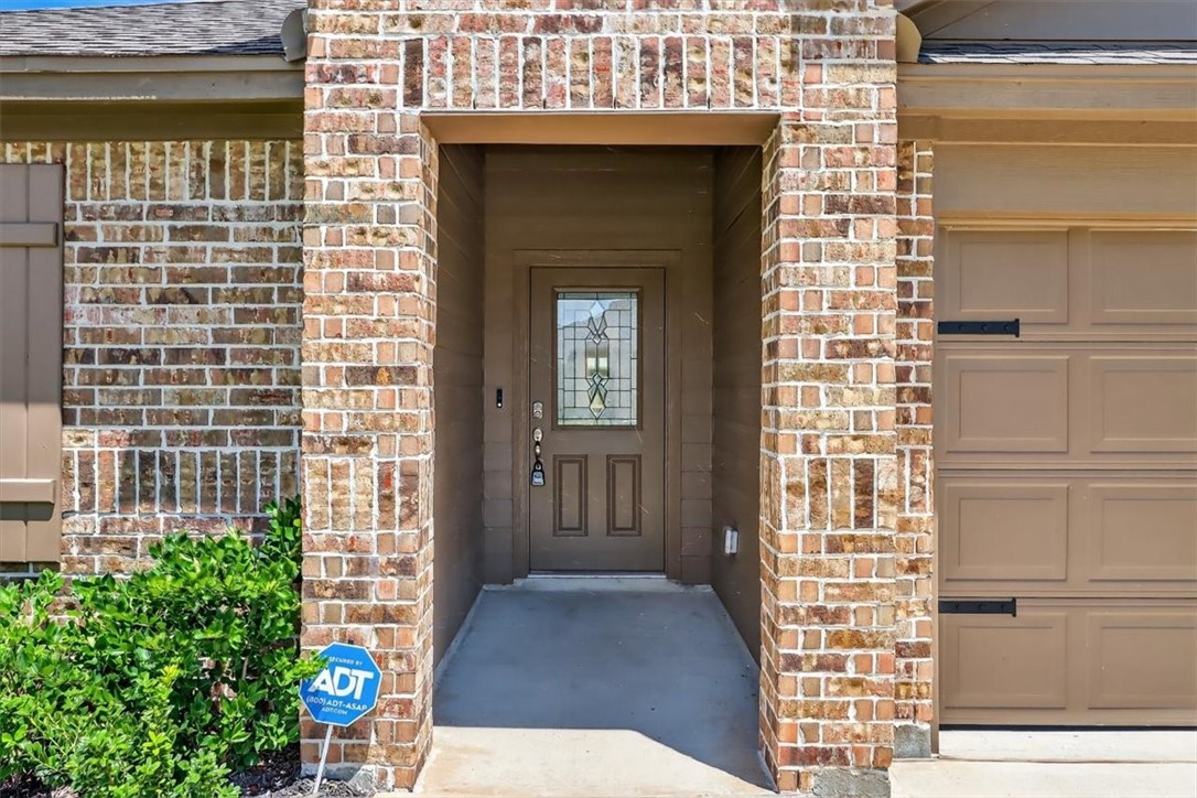 1126 Carnaby Street Corpus Christi, TX 78415 - Photo 2 of 39 a view of front door of house with wooden floor