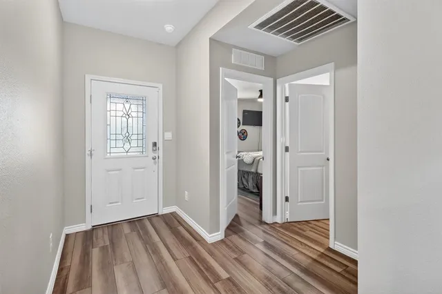 a view of a livingroom with wooden floor