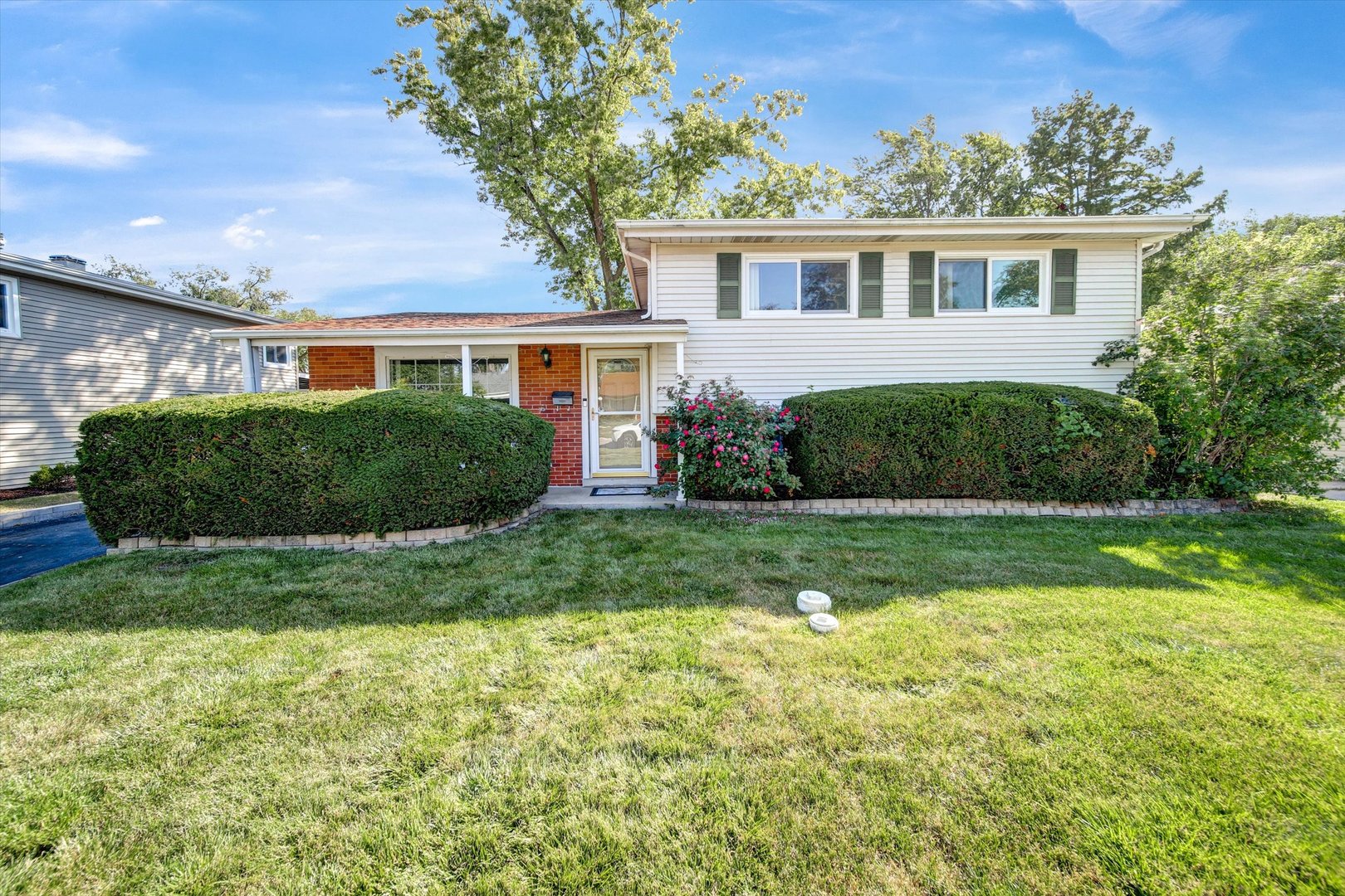 front view of a house with a yard