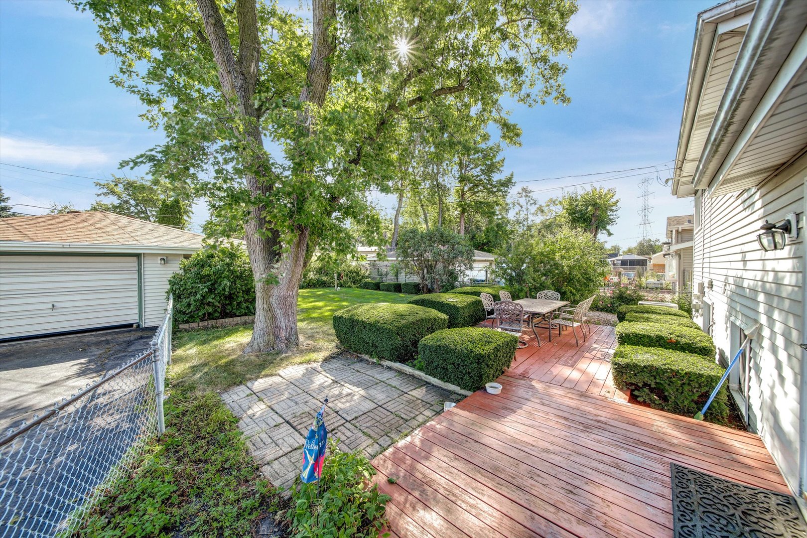 445 South Yale Avenue Addison, IL 60101 - Photo 18 of 20 a view of a backyard with potted plants and large tree