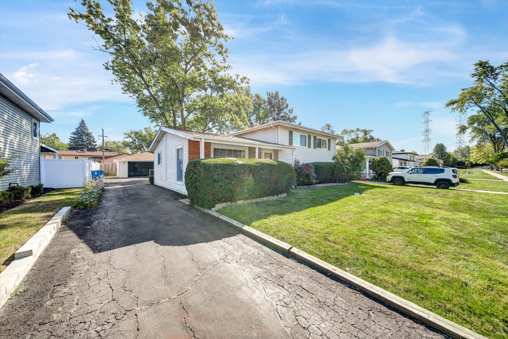445 South Yale Avenue Addison, IL 60101 - Photo 2 of 20 a view of a backyard with a garden and plants