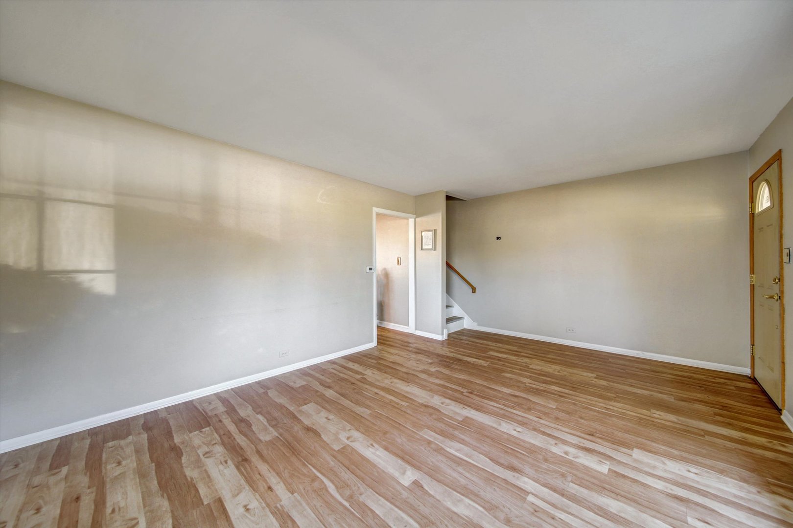 445 South Yale Avenue Addison, IL 60101 - Photo 4 of 20 a view of empty room with wooden floor